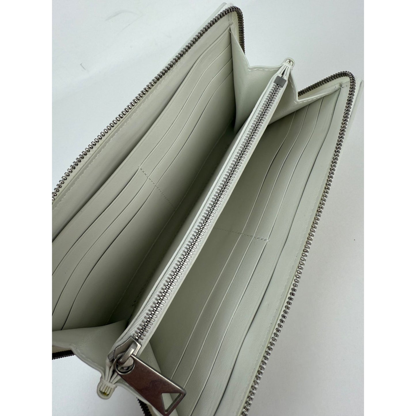 
                  
                    Bottega Veneta Intrecciato Leather White Cassette Zip Around Wallet
                  
                