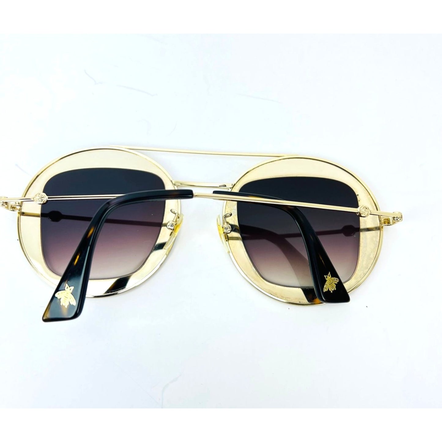
                  
                    Gucci Round Frame Sylvie Web Sunglasses GG0105S
                  
                