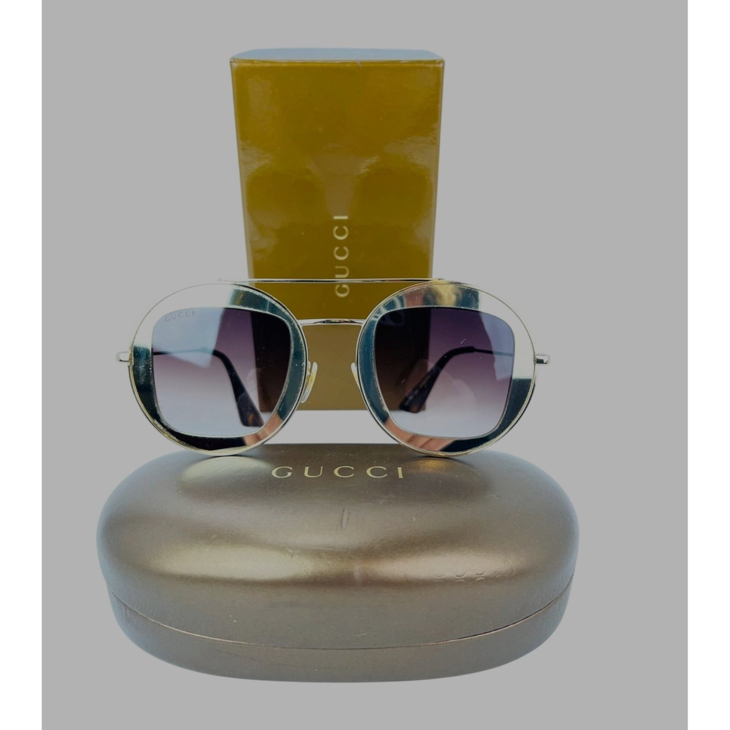 
                  
                    Gucci Round Frame Sylvie Web Sunglasses GG0105S
                  
                