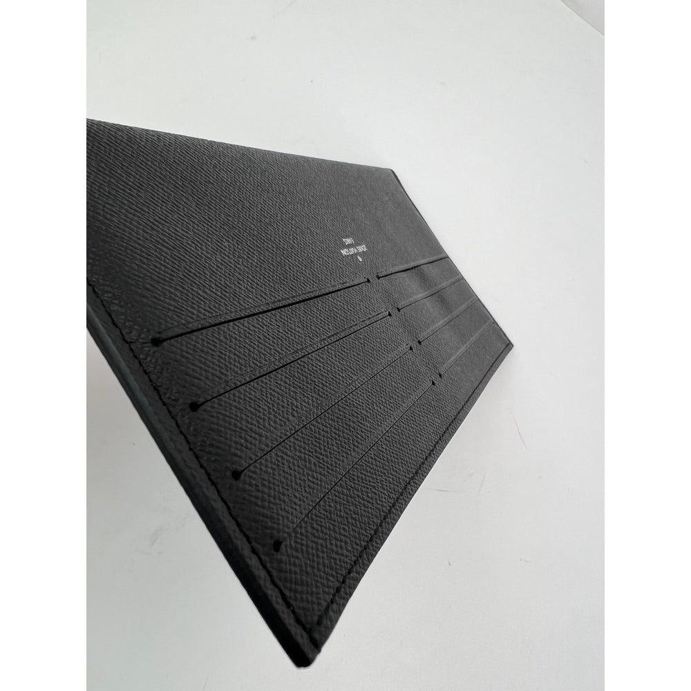 
                  
                    Louis Vuitton 8 Credit Card Insert Black Leather wallet from Felicie
                  
                