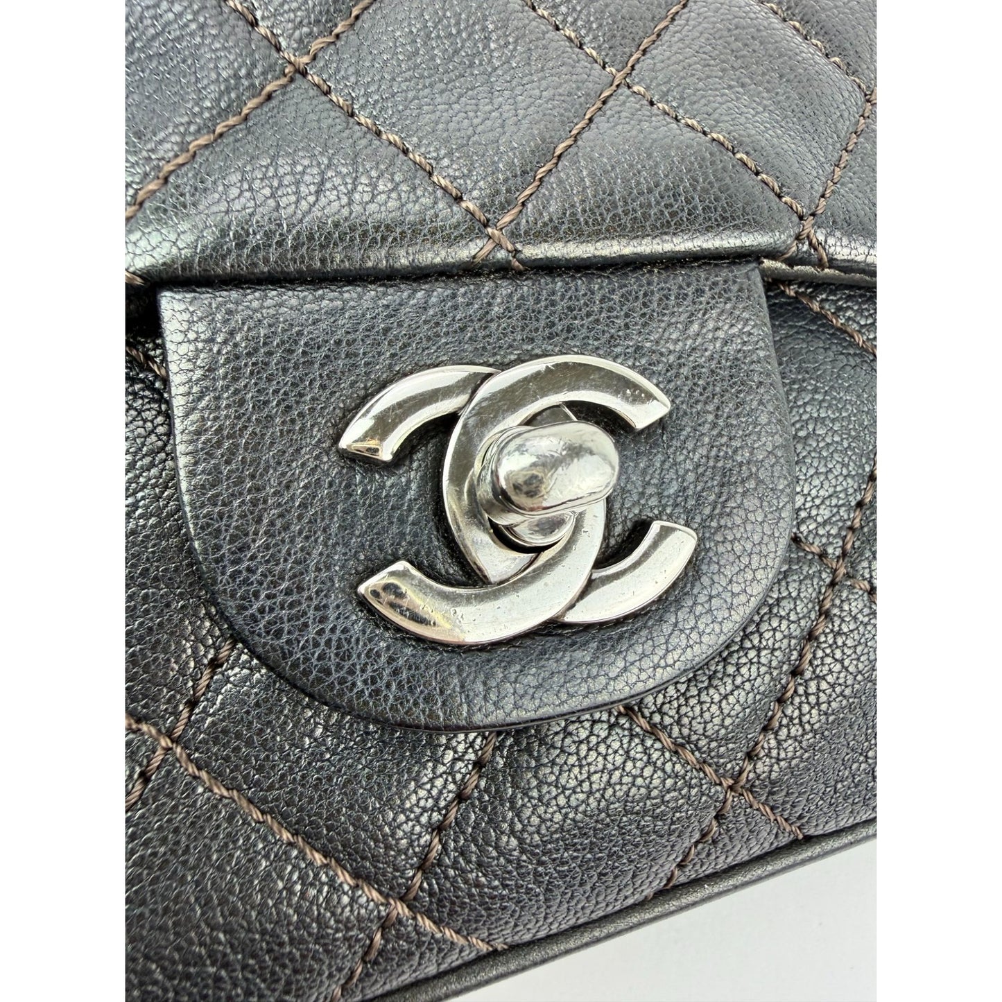 
                  
                    Chanel Metallic Goatskin Quilted Small Rock In Rome Flap Charcoal Crossbody Bag
                  
                