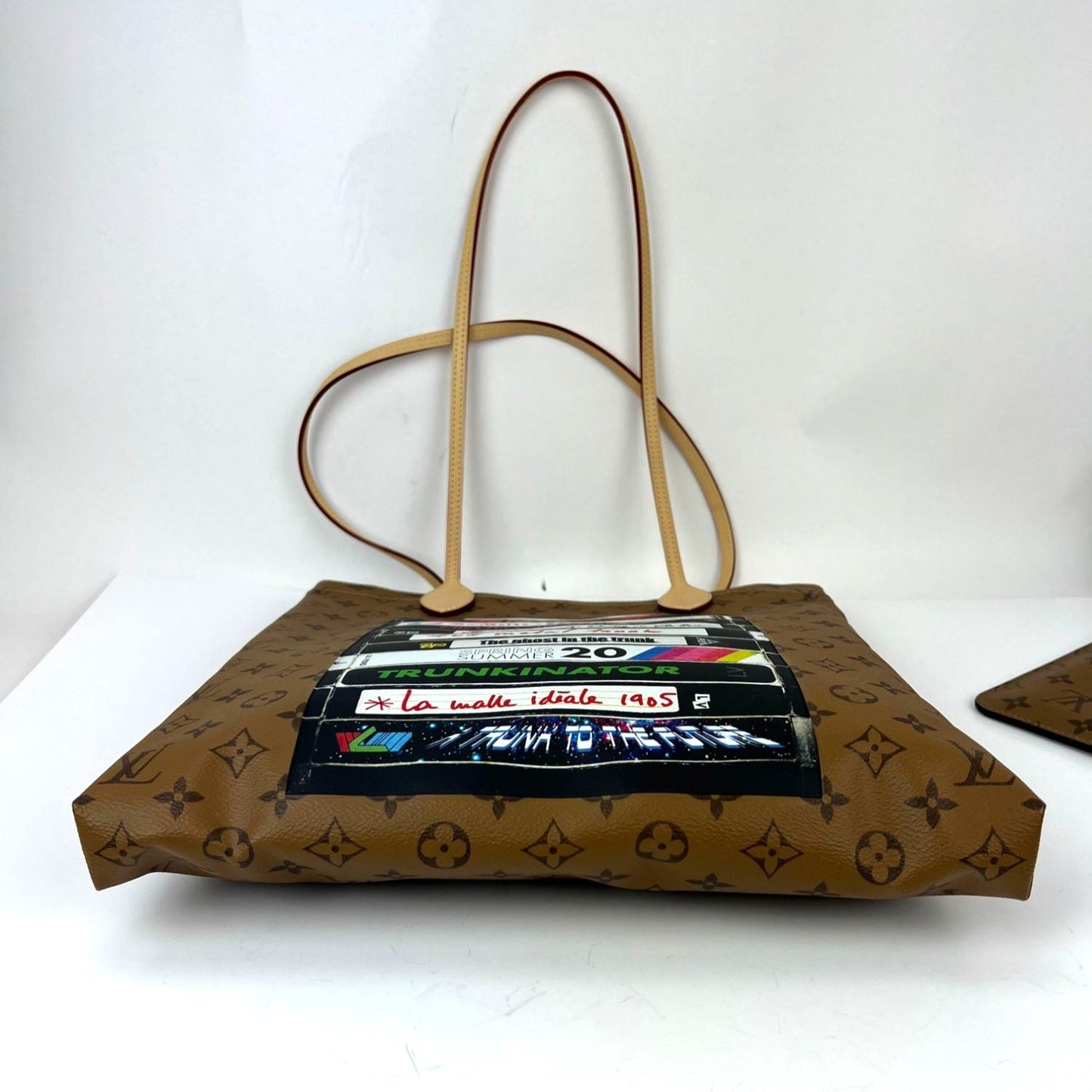 
                  
                    Louis Vuitton Carry It Limited Edition Reverse Monogram Video Tape Tote Bag
                  
                