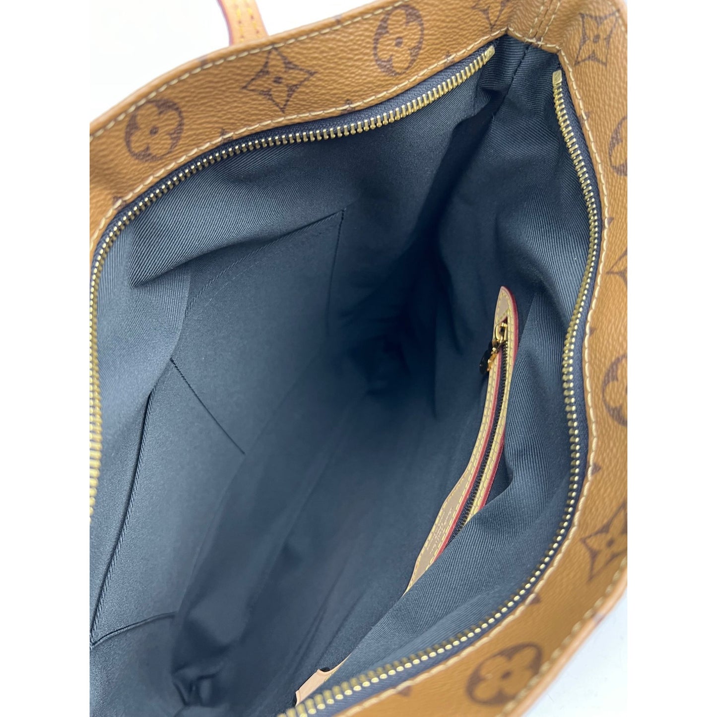 
                  
                    Louis Vuitton Carry It Limited Edition Reverse Monogram Video Tape Tote Bag
                  
                