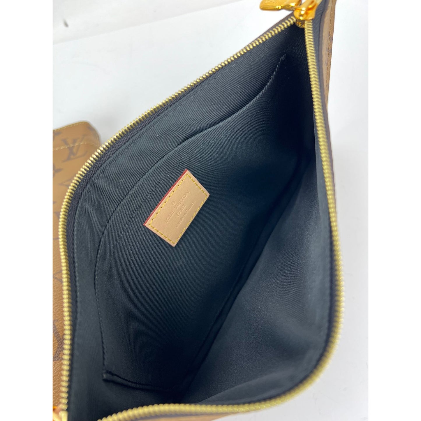 
                  
                    Louis Vuitton Carry It Limited Edition Reverse Monogram Video Tape Tote Bag
                  
                