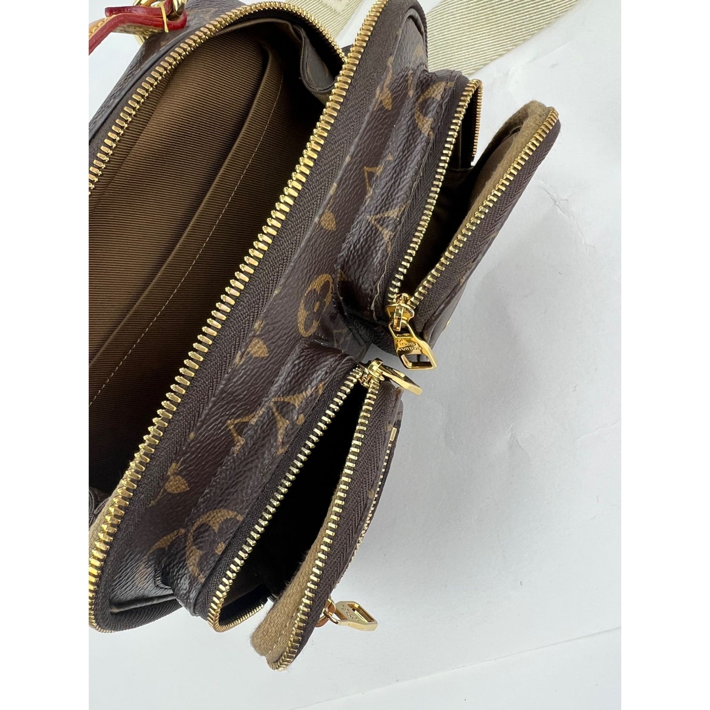
                  
                    Louis Vuitton Utility Monogram Crossbody Bag
                  
                