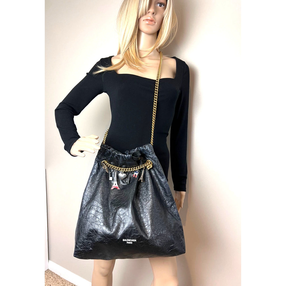 
                  
                    Balenciaga Leather Crush Medium Black Paris Charms Tote Bag
                  
                