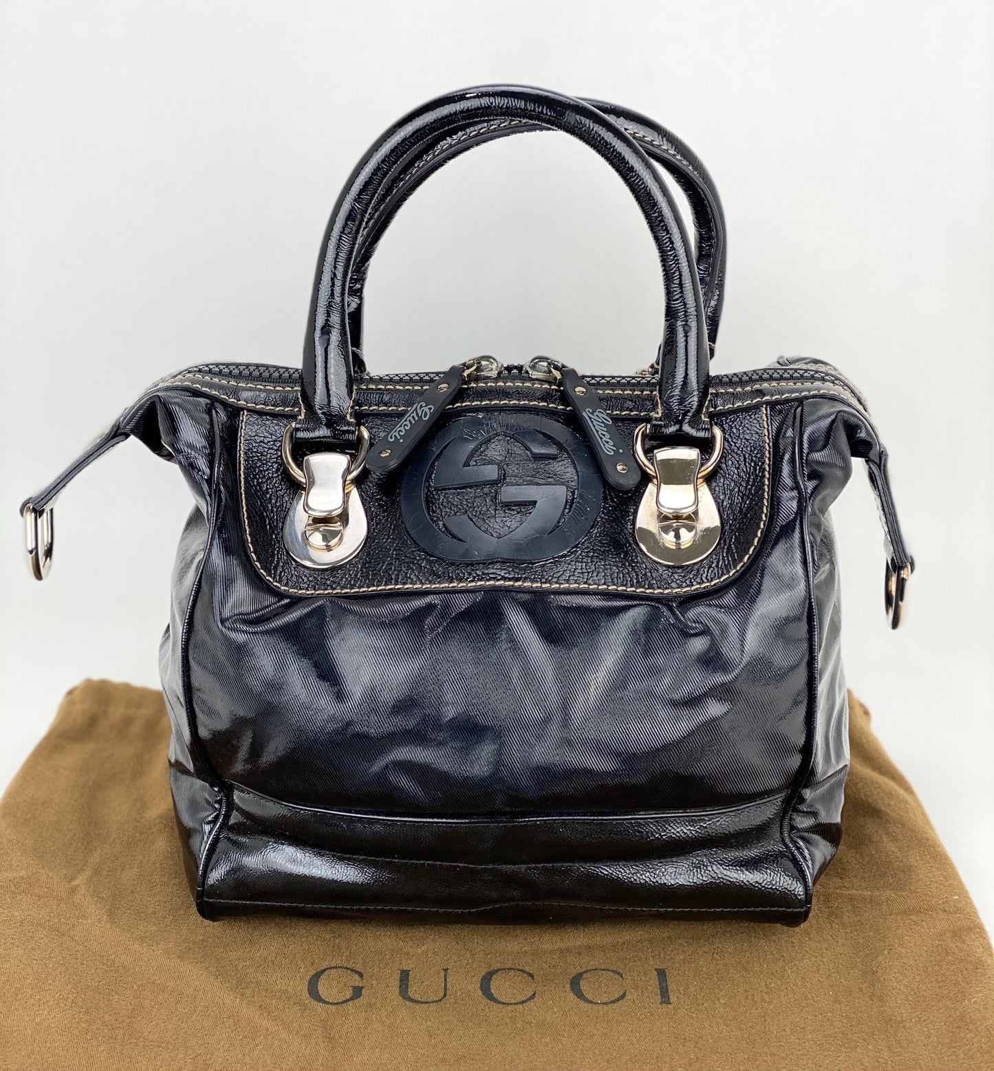 
                  
                    GUCCI Dialux Snow Glam Black Canvas and Leather Boston Shoulder Bag
                  
                