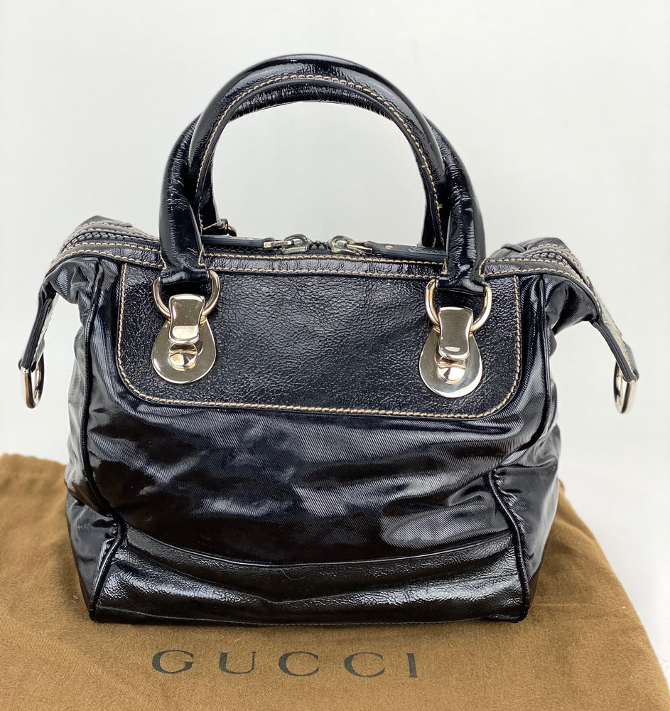 
                  
                    GUCCI Dialux Snow Glam Black Canvas and Leather Boston Shoulder Bag
                  
                